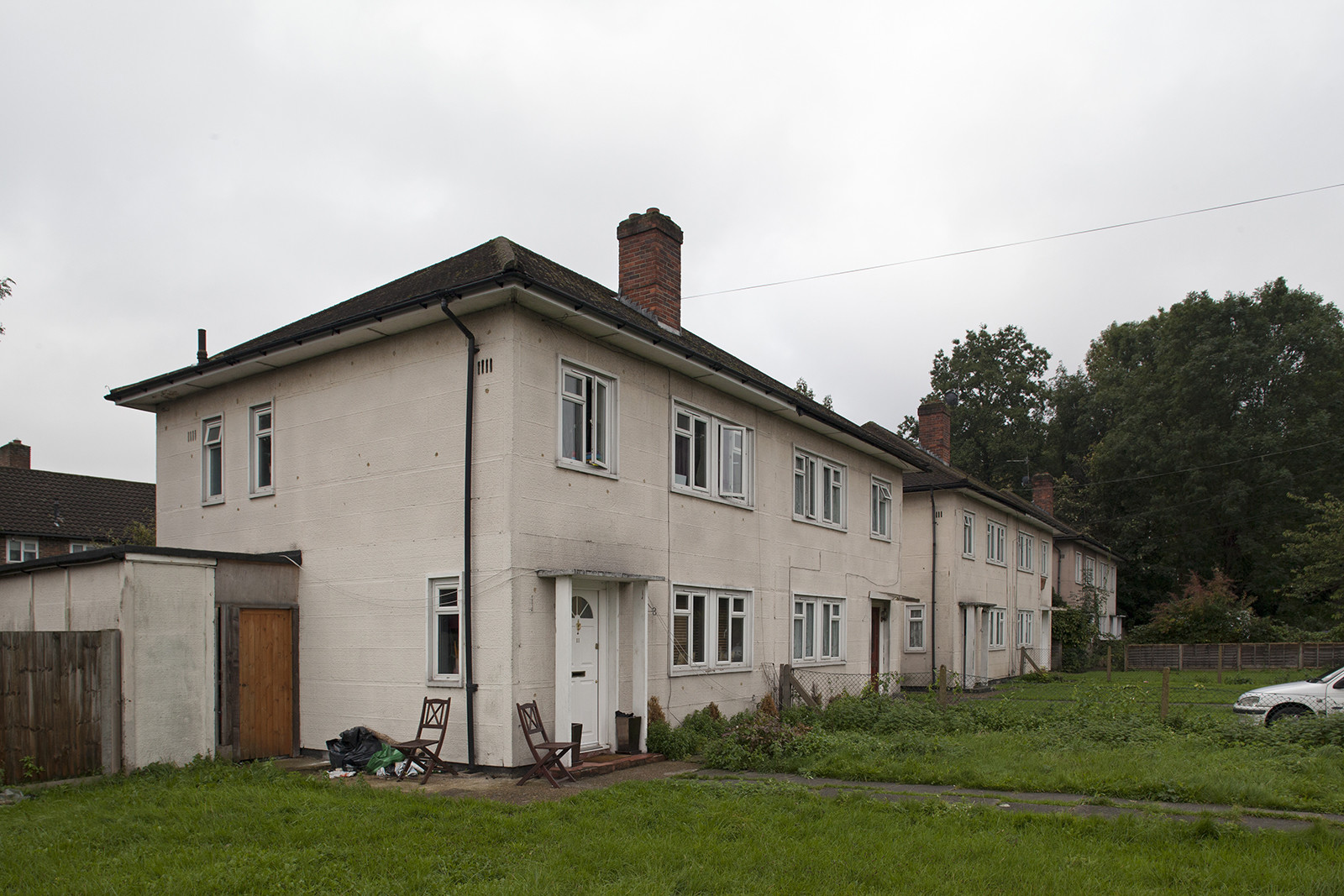 A run-down, post-war semi-detached home.